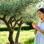 Home 15 **
"A serene woman practicing mindful breathing outdoors in a lush Italian garden, surrounded by olive trees and blooming flowers. She is wearing comfortable, modest clothing, fully clothed in a light linen dress. Sunlight filters through the leaves, creating a peaceful atmosphere. Focus on her calm expression and relaxed posture. Perfect anatomy, correct proportions, well-formed hands, proper finger count, natural body proportions. Safe for work, appropriate content, family-friendly, professional photography, high quality, serene."
**